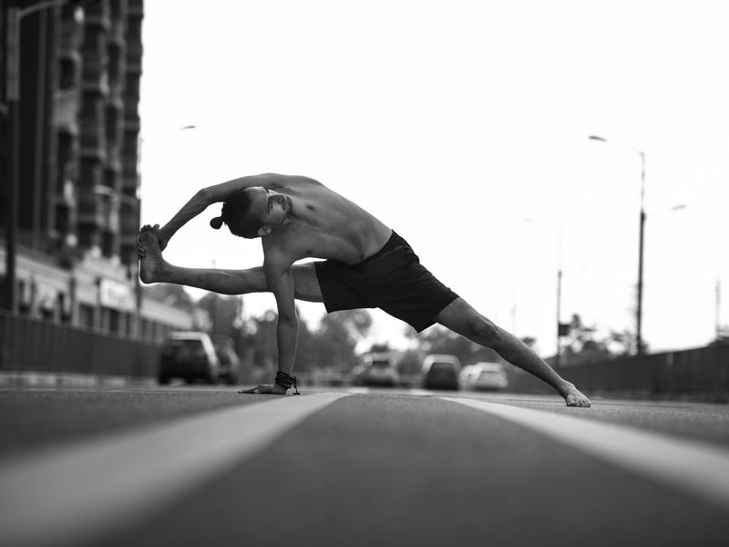 A person in a dynamic but controlled motion pose.