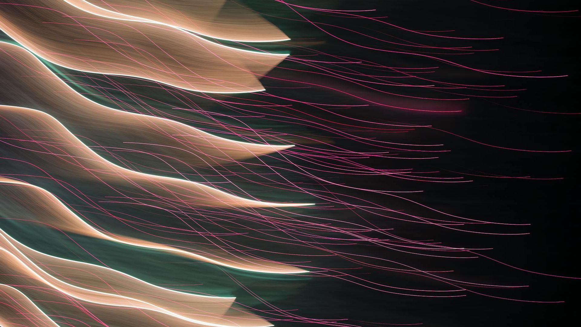 Abstract rhythmic light patterns on a dark background.